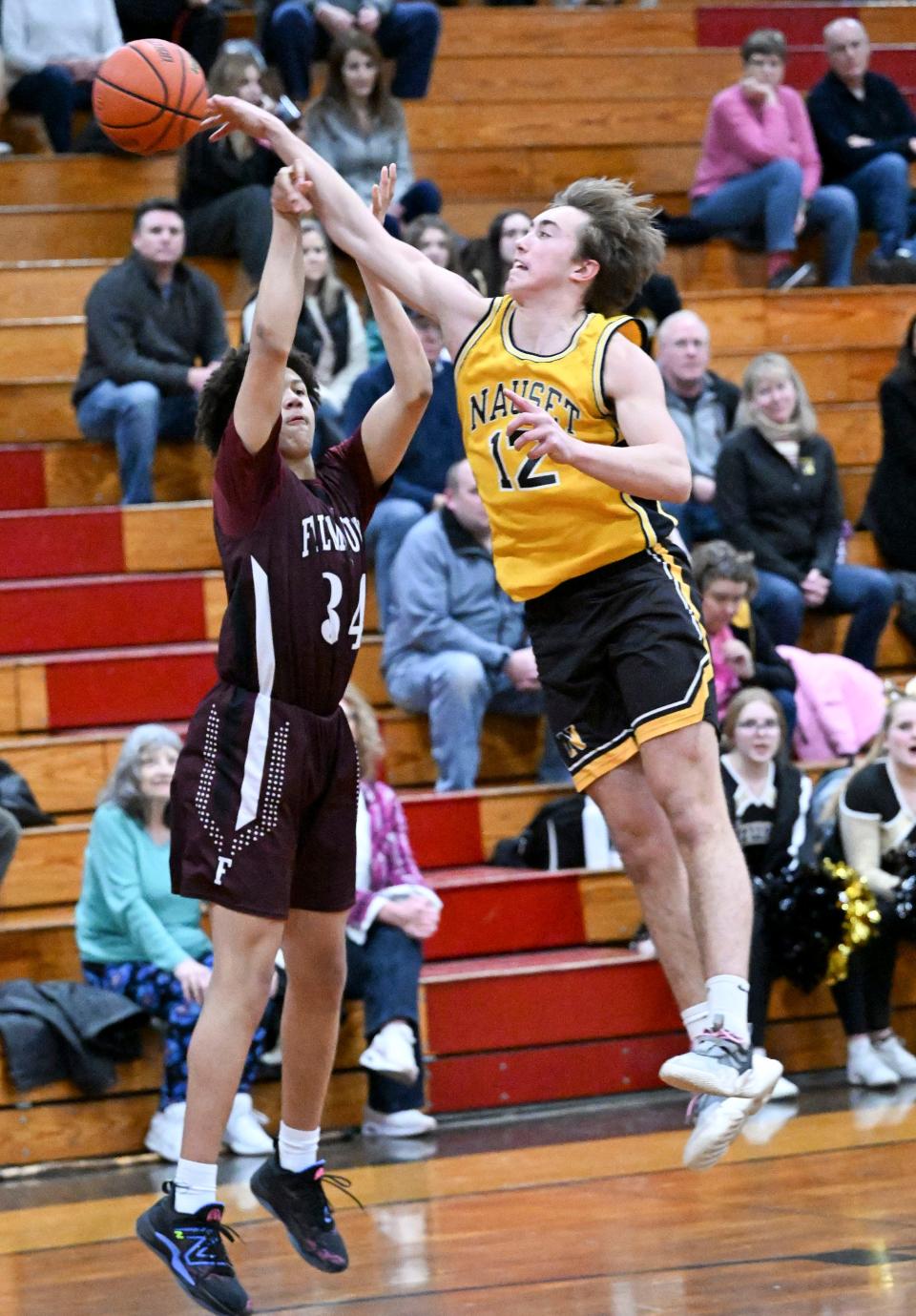 Dillon White of Nauset blocks a shot by Myles Peterkin of Falmouth.
(Photo: Ron Schloerb/Cape Cod Times)