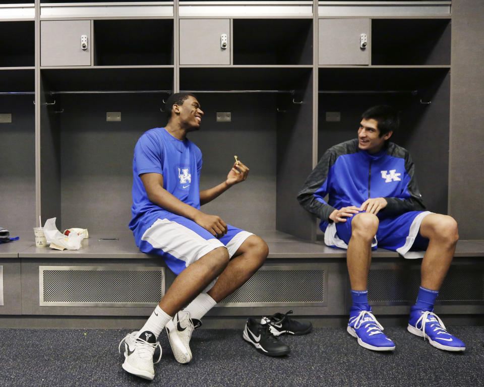 Kentucky center Dakari Johnson, left and forward Derek Willis chat in the locker room before practice for the NCAA Final Four tournament college basketball championship game Sunday, April 6, 2014, in Arlington, Texas. Kentucky plays Connecticut in the championship game on Monday, April 7. 2014. (AP Photo/Eric Gay)