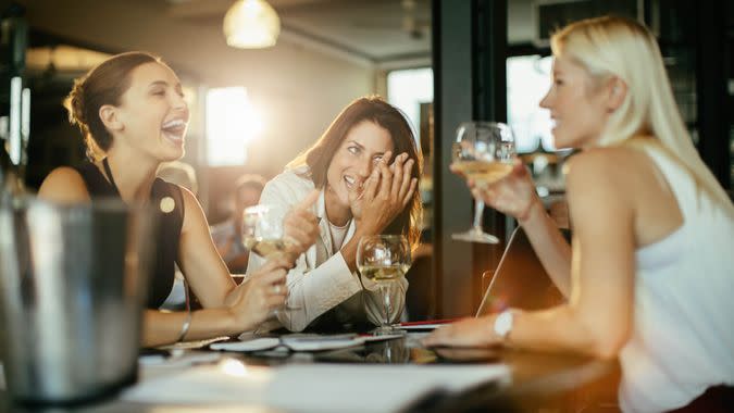 Close up of a group of business people having a drink after work.