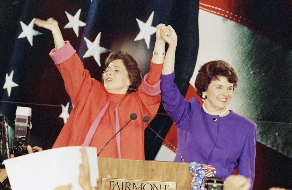 Democratic Senate candidates Barbara Boxer, left, and Dianne Feinstein raise their arms in victory and wave to supporters at an election rally in San Francisco Nov. 3, 1992. The two women claimed victory over their Republican male rivals, Bruce Herschensohn and Sen. John Seymour. Feinstein, who served in the Senate for 30 years, died Friday, Sept. 29, 2023, at the age of 90.