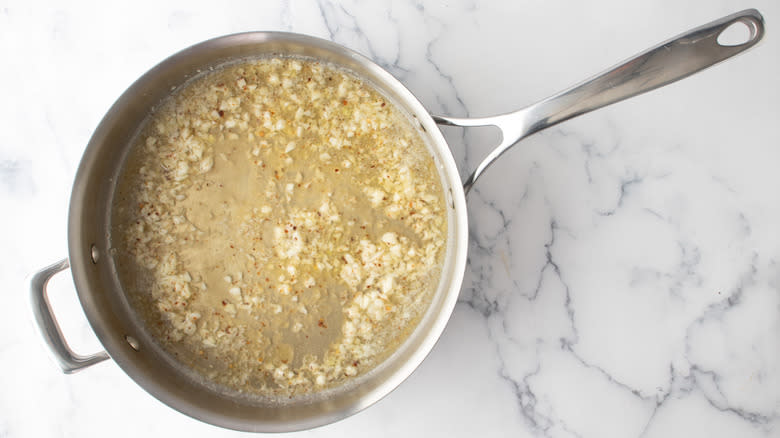 garlic butter and wine in pan