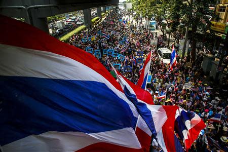 Anti-government protesters take part in a rally in central of Bangkok March 24, 2014. REUTERS/Athit Perawongmetha