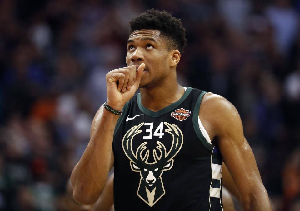 Milwaukee Bucks forward Giannis Antetokounmpo (34) looks at the scoreboard during the second half of an NBA basketball game against the Phoenix Suns, Monday, March 4, 2019, in Phoenix. (AP Photo/Matt York)