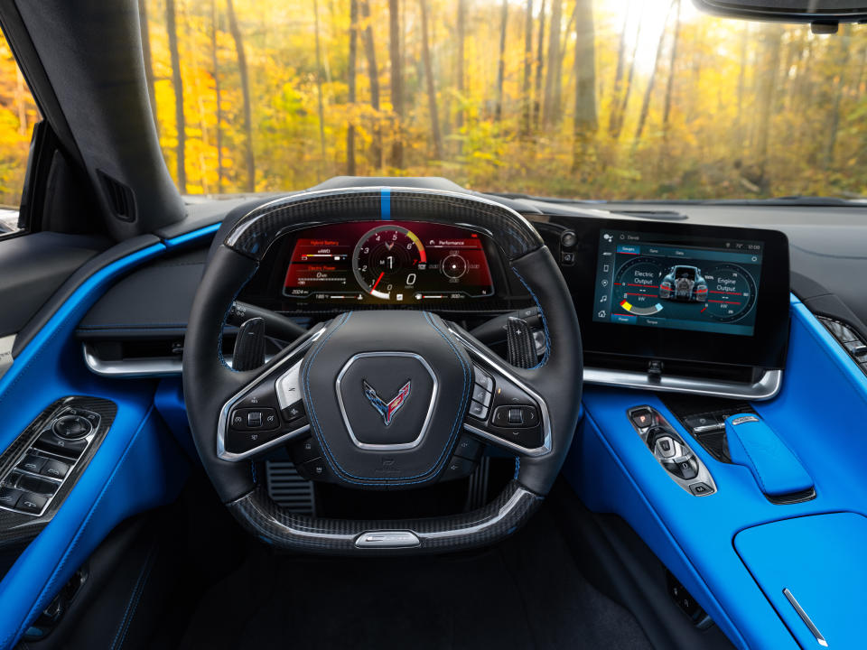 View from driverâ€™s seat in 2024 Chevrolet Corvette E-Ray 3LZ coupe in Silver Flare with Two Tone Blue Interior. Pre-production model shown. Actual production model may vary. Model year 2024 Corvette E-Ray available 2023.