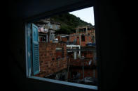 Houses are seen through a window of Tiki hostel in Cantagalo favela, in Rio de Janeiro, Brazil, April 15, 2016. REUTERS/Pilar Olivares