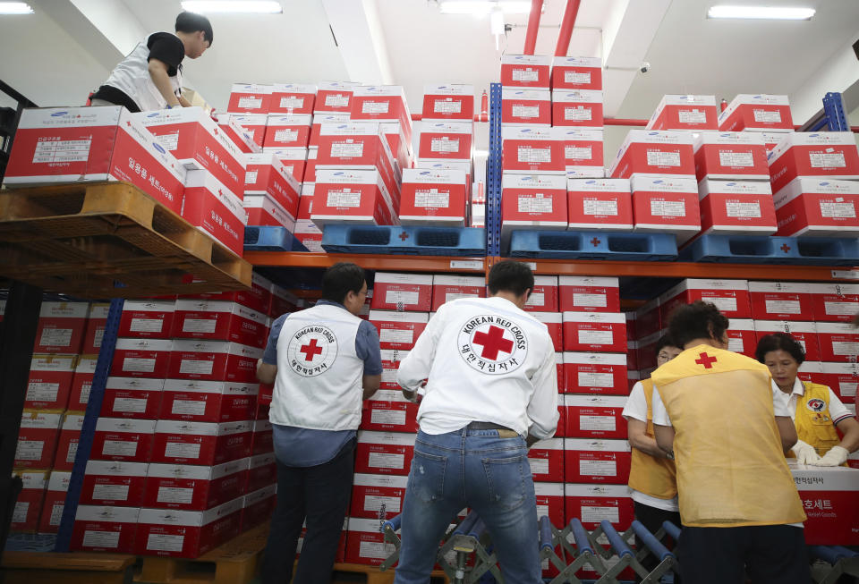 Workers from Korea Red Cross prepares aid supply kits as Typhoon Lingling approaches to Korean peninsular in Seoul, South Korea, Friday, Sept. 6, 2019. (Kim Ju-sung/Yonhap via AP)