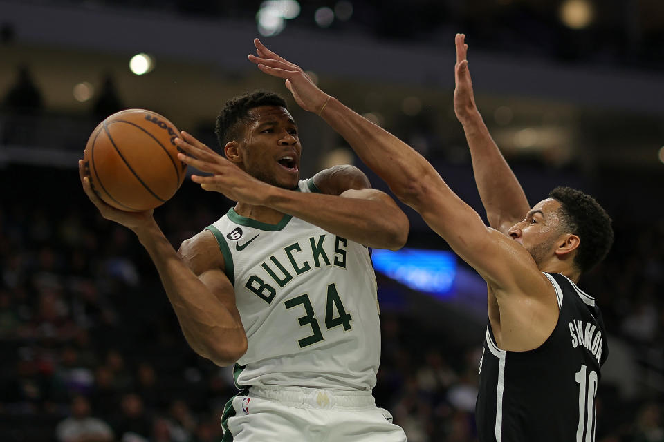 MILWAUKEE, WISCONSIN - OCTOBER 12: Giannis Antetokounmpo #34 of the Milwaukee Bucks is defended by Ben Simmons #10 of the Brooklyn Nets during the first half of a preseason game at Fiserv Forum on October 12, 2022 in Milwaukee, Wisconsin. NOTE TO USER: User expressly acknowledges and agrees that, by downloading and or using this photograph, User is consenting to the terms and conditions of the Getty Images License Agreement. (Photo by Stacy Revere/Getty Images)