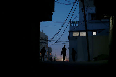 A Palestinian man walks during power cut at Shati refugee camp in Gaza City April 25, 2017. Picture taken April 25, 2017. REUTERS/Mohammed Salem