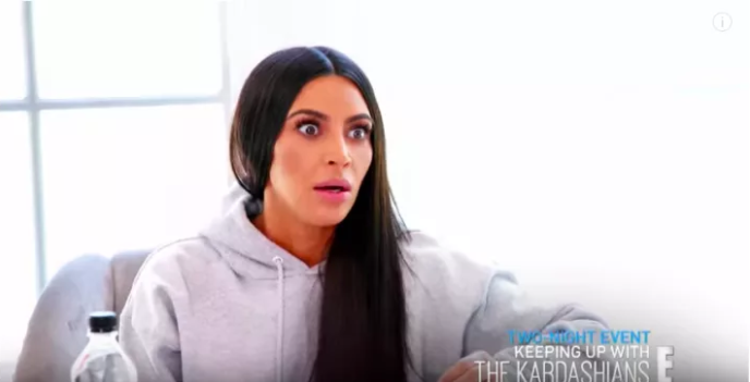 Kim Kardashian-West looks very surprised by the soon-to-be revealed news. Source: E!