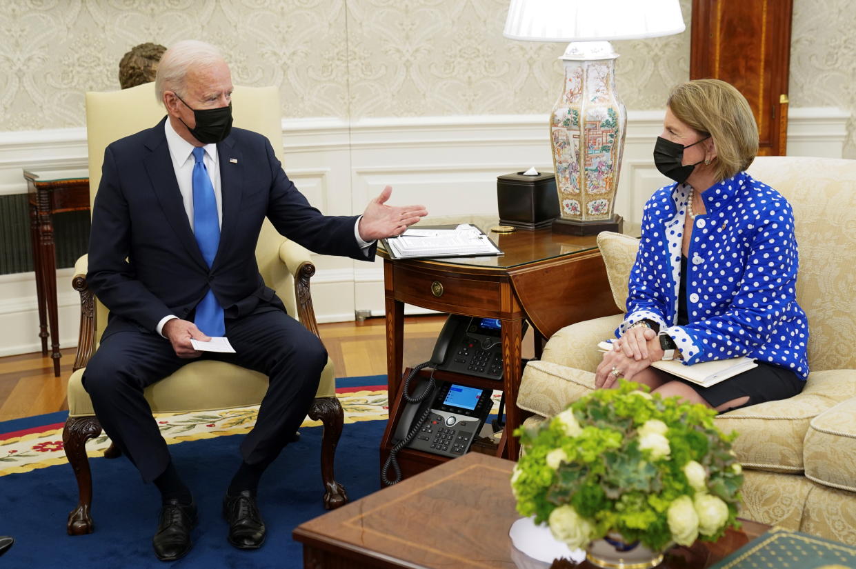 President Biden gestures toward Sen. Shelley Capito, R-W.V., during an infrastructure meeting with Republican senators. (Kevin Lamarque/Reuters)