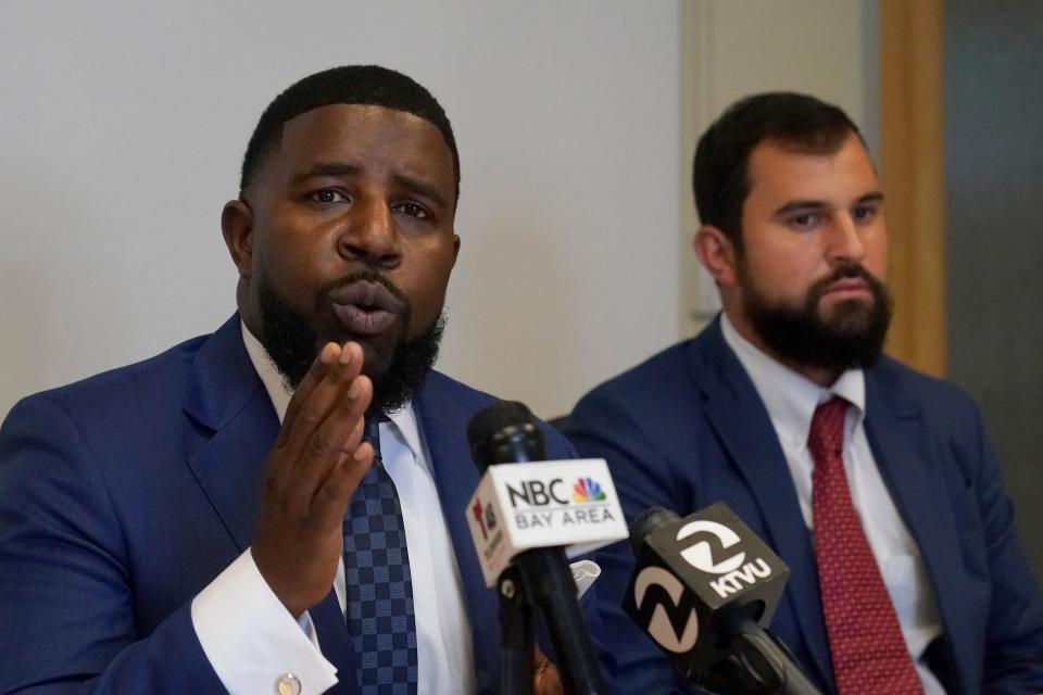Attorneys AdantÃ© Pointer, left, and Patrick Buelna, who represent a woman whose DNA from a sexual assault case was used by San Francisco police to arrest her in an unrelated property crime, speak during a news conference announcing their lawsuit against the city of San Francisco at their law office in Oakland, Calif., Monday, Sept. 12, 2022. (AP Photo/Jeff Chiu)