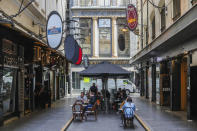 Outdoor diners are seen at a popular laneway cafe precinct in Melbourne, Australia, Wednesday, Oct. 28, 2020. Australia’s second largest city of Melbourne which was a coronavirus hotspot emerges from a nearly four-months lockdown, with restaurants, cafes and bars opening and outdoor contact sports resuming on Wednesday. (AP Photo/Asanka Brendon Ratnayake)