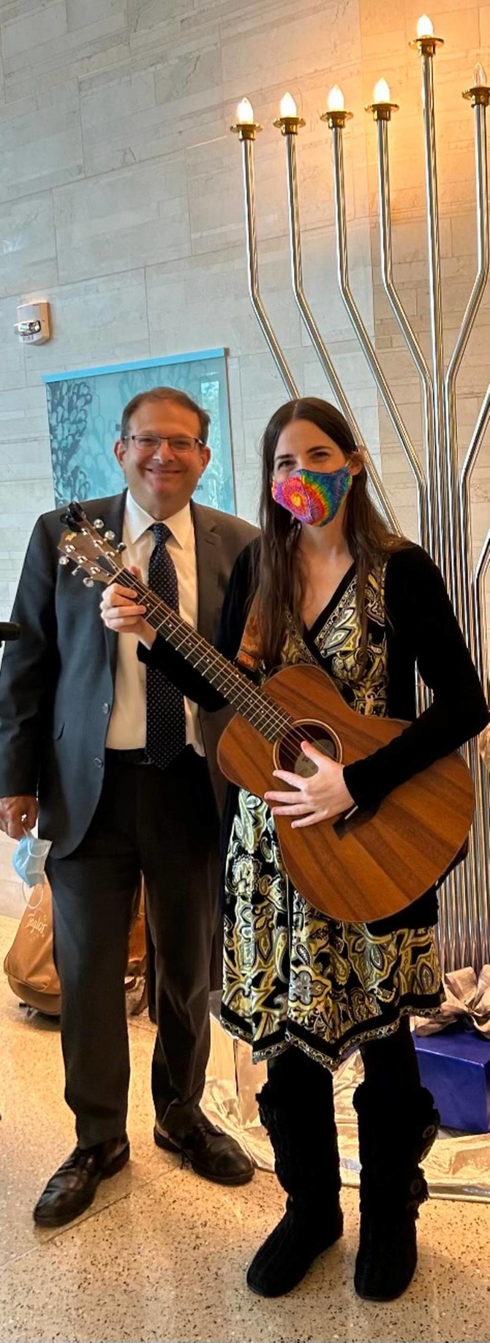 Rabbi Frederick Klein and cantor Laura Lenes led a Hanukkah program for patients at the Miami Cancer Institute. The rabbi and volunteers lit candles, sang songs and distributed Hanukkah donuts to those receiving treatment. Klein leads a Greater Miami Jewish Federation program called Refuat Ha-Nefesh Fellows, which provides support to seniors and the ill.