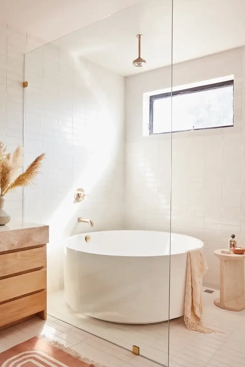 Bathroom with freestanding tub in the shower. 