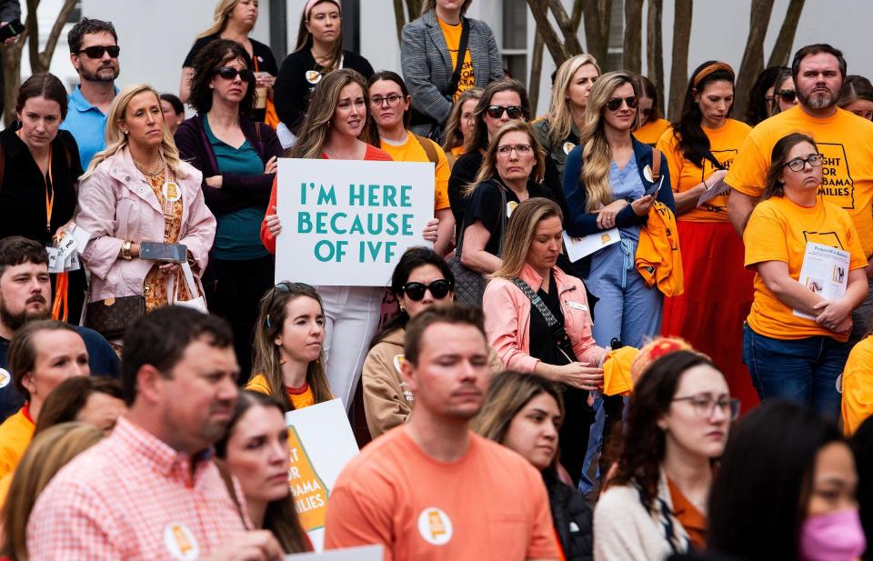 Sarah Brown holds a sign in the crowd during a protest rally for in vitro fertilization legislation at the Alabama Statehouse in Montgomery, Ala., on February 28.