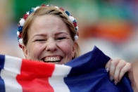 <p>An Iceland fan holds up her nation’s flag. </p>