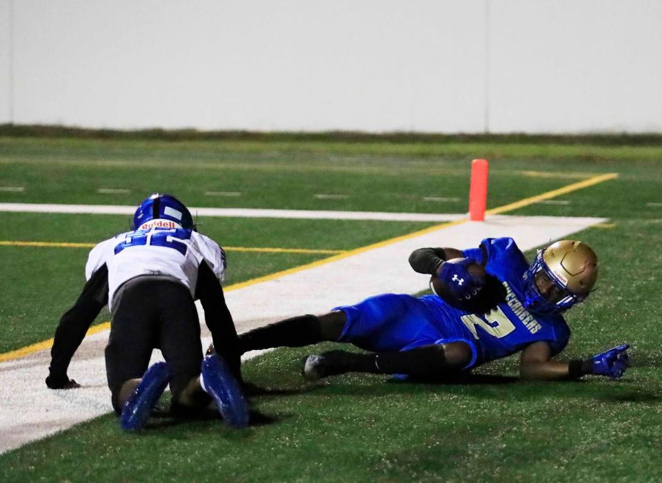 Mainland’s Phillip Moore (2) catches a touchdown during Friday night’s playoff game against Sebring, Nov. 24, 2023 at Daytona Stadium.