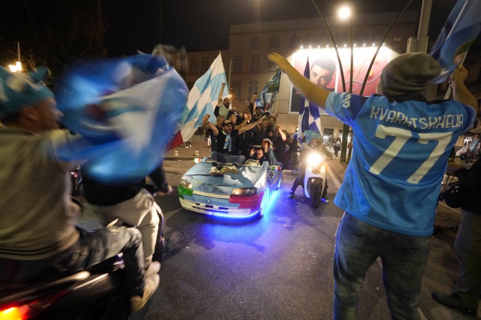 Napoli fans celebrate after winning the Italian league soccer title, in Naples, Italy, Thursday, May 4, 2023. Napoli won its first Italian soccer league title since the days when Diego Maradona played for the club, sealing the trophy with a 1-1 draw at Udinese on Thursday. (AP Photo/Andrew Medichini)