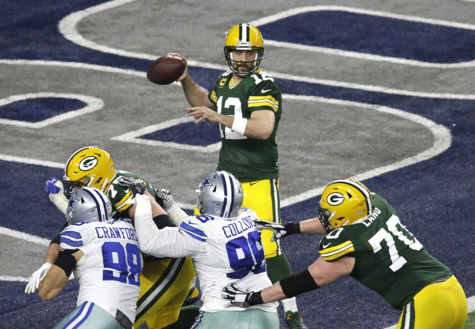 Green Bay Packers quarterback Aaron Rodgers throws a pass against the Dallas Cowboys during the first half of an NFL divisional playoff football game Sunday, Jan. 15, 2017, in Arlington, Texas. (AP Photo/Mat Otero)