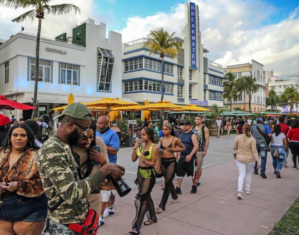 Despite the coronavirus, spring breakers return to South Beach and walk along Ocean Drive that is closed to traffic on Thursday, March 12, 2021.