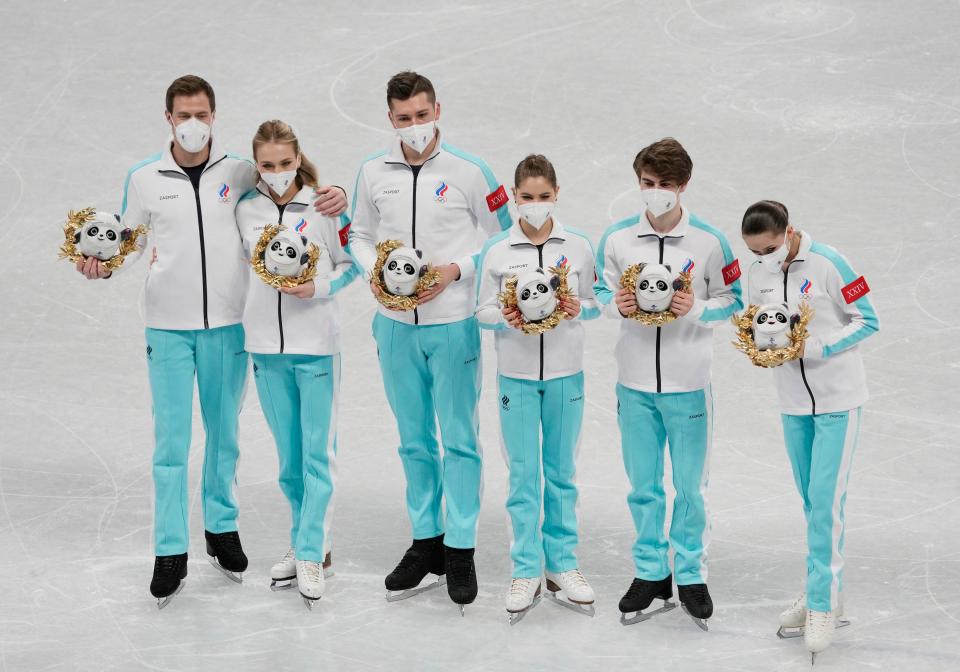 Olympic gold medalists from Russia celebrate after the figure skating mixed team competition during the Beijing Olympics.