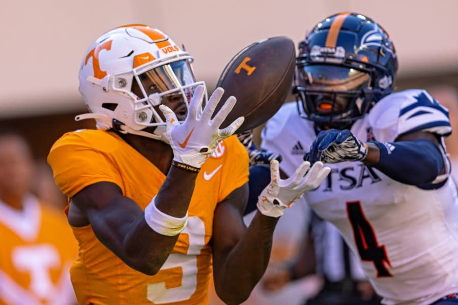 Tennessee wide receiver Ramel Keyton (9) catches a pass as UTSA cornerback Nicktroy Fortune (4) defends during the first half of an NCAA college football game Saturday, Sept. 23, 2023, in Knoxville, Tenn. (AP Photo/Wade Payne)