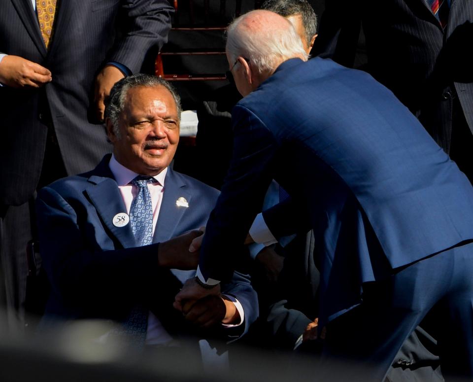 President Joe Biden greets Rev. Jesse Jackson at  the Edmund Pettus Bridge in Selma, Ala., on Sunday March 5, 2023 to commemorate the 58th anniversary of the Bloody Sunday bridge crossing.