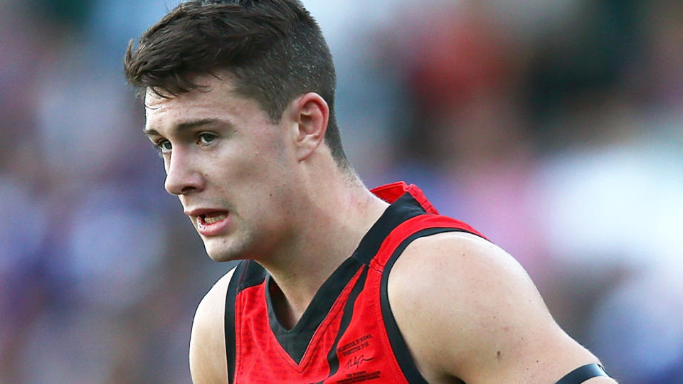 Conor McKenna is pictured playing for Essendon in the AFL.