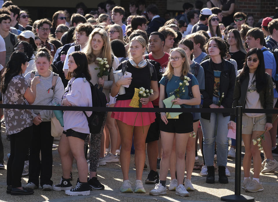 University of Georgia students gather to pay tribute to Laken Riley at the Tate Plaza on campus in Athens, Ga., Monday, Feb. 26, 2024. Riley, a nursing student at Augusta University's Athens campus, was found dead Thursday, Feb. 22, after a roommate reported she didn't return from a morning run in a wooded area of the UGA campus near its intramural fields. Students also gathered to pay tribute to a UGA student who committed suicide last week. (Nell Carroll/Atlanta Journal-Constitution via AP)