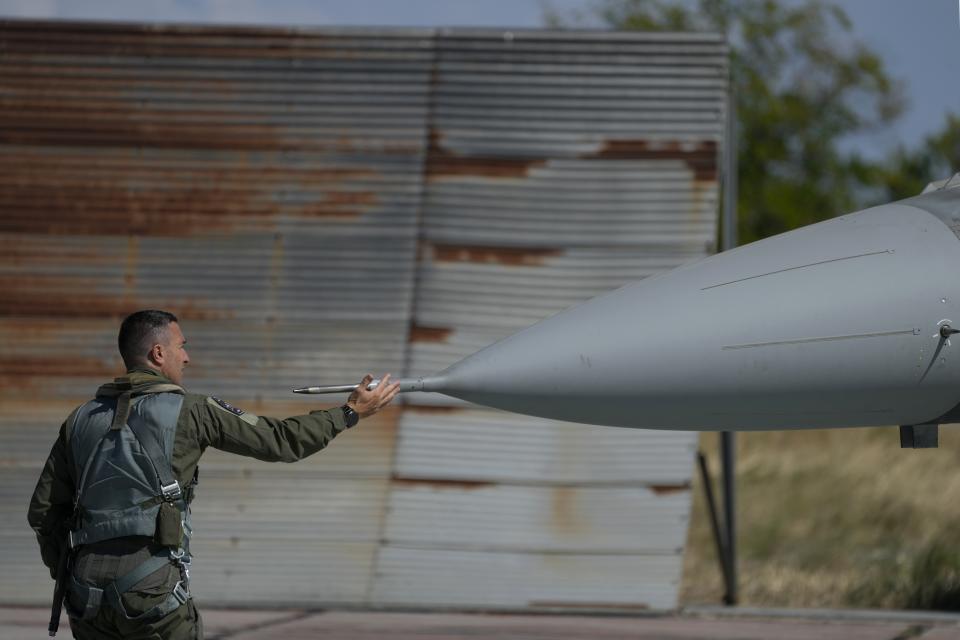 The pilot of Greek Fighter Jet F-16 Viper checks the aircraft before the takeoff at Tanagra air force base about 74 kilometres (46 miles) north of Athens, Greece, Monday, Sept. 12, 2022. Greece's air force on Monday took delivery of a first pair of upgraded F-16 military jets, under a $1.5 billion program to fully modernize its fighter fleet amid increasing tension with neighboring Turkey. (AP Photo/Thanassis Stavrakis)