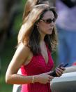 <p>Middleton at age 24 watching Prince William compete in the Chakravarty Cup charity polo match. By this point in her life, she was an accessories buyer for the clothing brand Jigsaw and was still helping out with the family business.</p>