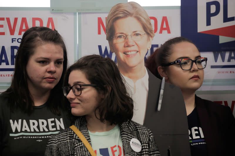 Supporters listen next to a cardboard cutout of U.S. Democratic presidential candidate Senator Elizabeth Warren during a "Canvass Kickoff" event at Warren’s campaign field office in North Las Vegas