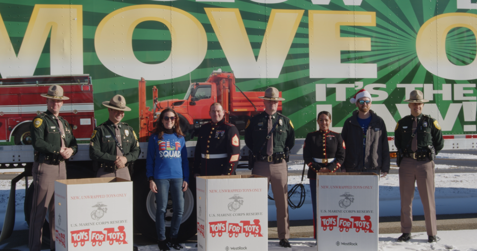 Service Credit Union employees drop off Toys for Tots donations purchased from local toy stores to State Police in Concord.