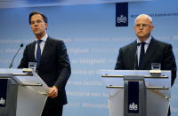 Dutch Prime Minister Mark Rutte, left, and Justice and Security Minister Ferd Grapperhaus speak to the media at a press conference in The Hague, Netherlands, Monday, March 18, 2019. Dutch police are hunting down a suspect after a shooting on a tram in the central Dutch city of Utrecht that left several dead and more wounded. Authorities immediately raised the terror alert for the area to the maximum level. “Our nation was hit by an attack in Utrecht,” Dutch Prime Minister Mark Rutte said. He said that “a terror motive is not excluded.” (AP Photo/Michael Corder)