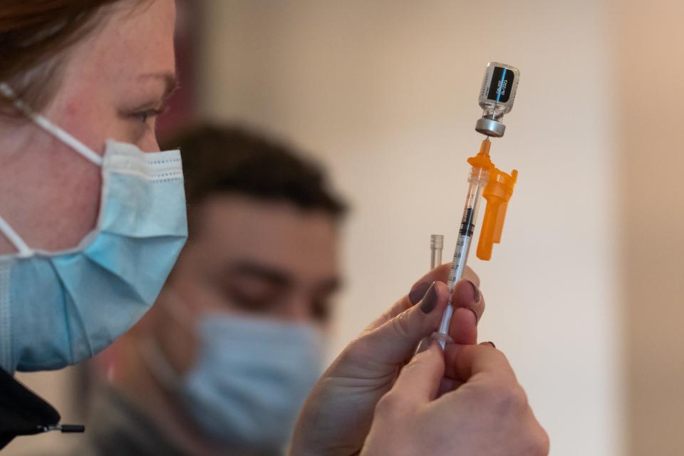 Nurses prepare doses of the Pfizer vaccine during a vaccination clinic as part of an outreach Henry Ford Health System at the Islamic Center of America in Dearborn on Monday, March 8, 2021. The clinic is part of the health system's initiative to get vaccines to communities that are vaccine hesitant due to rumors and disinformation about COVID19 vaccines. 