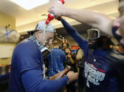 The Los Angeles Dodgers celebrate clinching a playoff spot after beating the San Francisco Giants in a baseball game in San Francisco, Saturday, Sept. 29, 2018. (AP Photo/Jim Gensheimer)