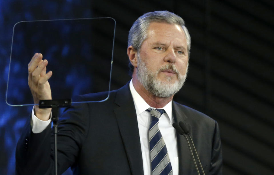 FILE - In this Nov. 28, 2018, file photo, Jerry Falwell Jr. speaks before a convocation at Liberty University in Lynchburg, Va. The university, led by Falwell, is pushing for criminal trespassing charges to be lodged against two journalists who pursued stories about why the evangelical college has remained partially open during the coronavirus outbreak. (AP Photo/Steve Helber, File)