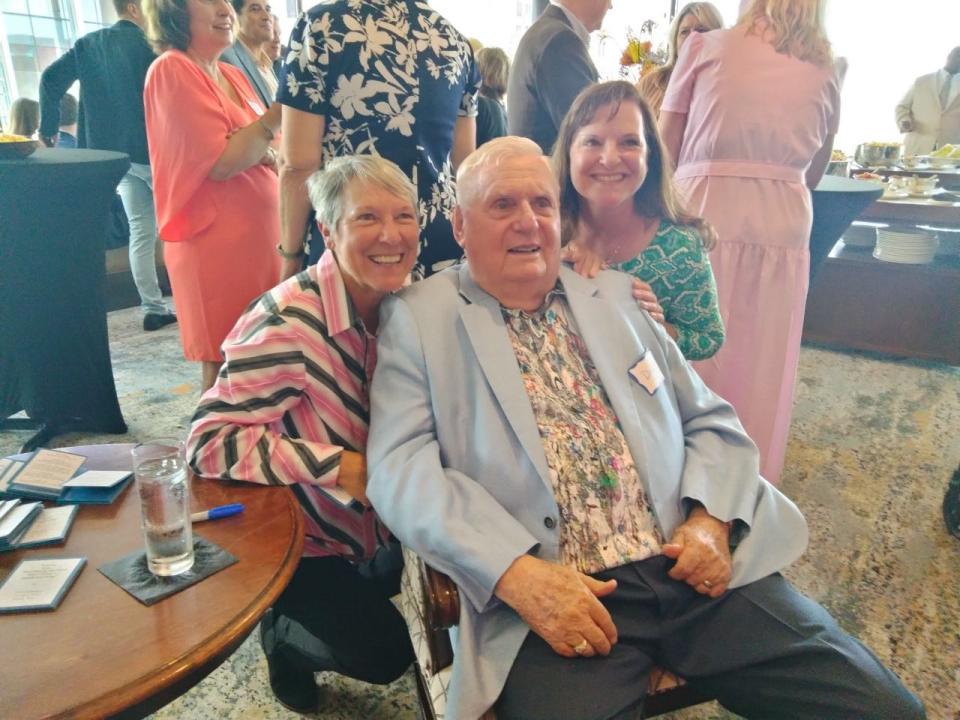 Dick Rathgeber is flanked by nieces Elaine Rathgeber, left, and Ruth Rathgeber Scribner at his 90th birthday party.