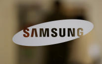 FILE - In this Oct. 25, 2020, file photo, a logo of Samsung Electronics is seen at its Seocho building in Seoul, South Korea. Samsung Electronics Co. said Thursday, Jan. 28, 2021, its operating profit for last quarter rose by more than 26% as it capped off a robust business year where its dual strength in parts and finished products allowed it to thrive amid the pandemic.(AP Photo/Lee Jin-man, File)