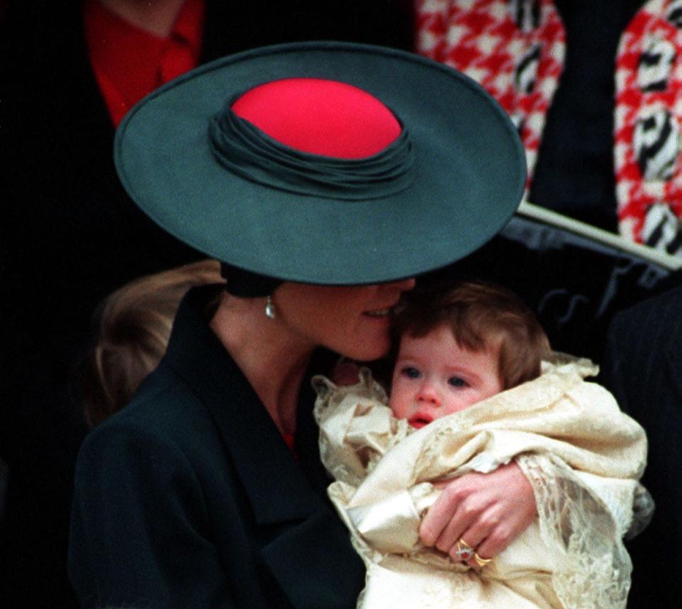 Sarah Ferguson holds Princess Eugenie at her christening in 1990.