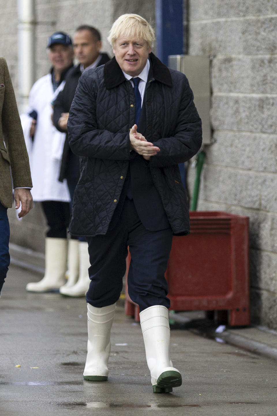 Britain's Prime Minister Boris Johnson leaves after a visit to Peterhead fish market near Aberdeen, Scotland, Friday Sept. 6, 2019, to coincide with the publication of Lord Bew's review and an announcement of extra funding for Scottish farmers. (Duncan McGlynn/PA via AP)