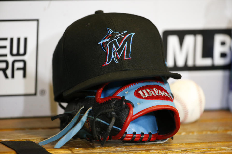 A Miami Marlins hat and glove.