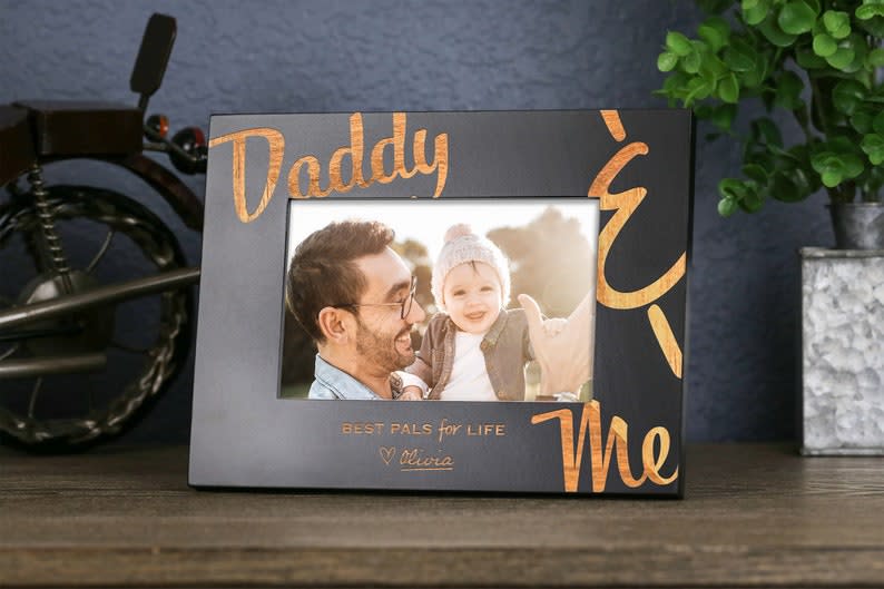 <p><a href="https://go.redirectingat.com?id=74968X1596630&url=https%3A%2F%2Fwww.etsy.com%2Flisting%2F1226753019%2Fdaddy-picture-frame-gift-first-fathers&sref=https%3A%2F%2Fwww.thepioneerwoman.com%2Fholidays-celebrations%2Fgifts%2Fg32814177%2Fgifts-for-dad%2F" rel="nofollow noopener" target="_blank" data-ylk="slk:Shop Now;elm:context_link;itc:0;sec:content-canvas" class="link rapid-noclick-resp">Shop Now</a></p><p>Personalized Dad Picture Frame</p><p>etsy.com</p><p>$24.95</p><span class="copyright">Etsy</span>