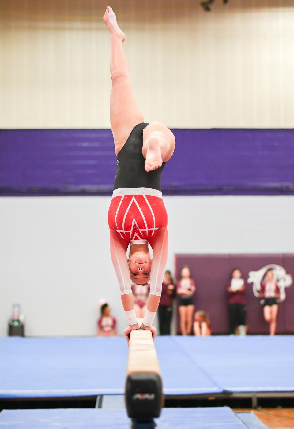 Edgewood’s Addison Goerges competes on the beam during the gymnastics meet against Bloomington North and Bloomington South at South on Monday, Jan. 8, 2024.