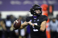 Washington quarterback Dylan Morris drops back to pass against Arizona during the first half of an NCAA college football game Saturday, Nov. 21, 2020, in Seattle. (AP Photo/Elaine Thompson)