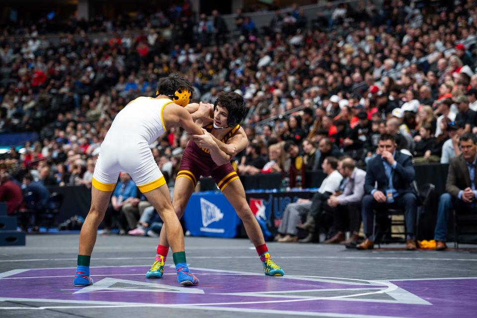 Windsor's James Pantoja locks up Manuel "Pocky" Amaro Pueblo East during his finals match at the Colorado state wrestling tournament at Ball Arena in Denver on Saturday.