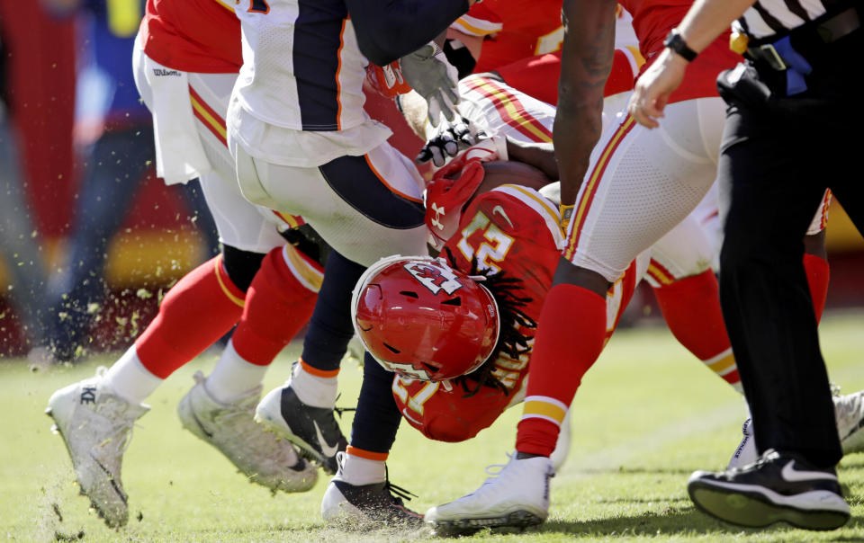 Kansas City Chiefs running back Kareem Hunt (27) lands into the end zone for a touchdown during the second half of an NFL football game against the Denver Broncos in Kansas City, Mo., Sunday, Oct. 28, 2018. (AP Photo/Orlin Wagner)