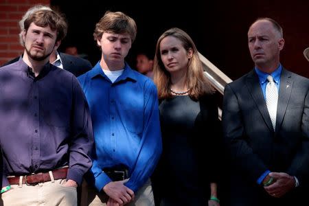 Family members of victims of the Sandy Hook Elementary School shooting, stand by during a news conference outside the Fairfield County Courthouse in Bridgeport, Connecticut, U.S., June 20, 2016, where the maker of the gun used in the 2012 massacre of 26 young children and educators at the Connecticut elementary school will ask a judge to toss a lawsuit saying the weapon never should have been sold to a civilian. REUTERS/Mike Segar