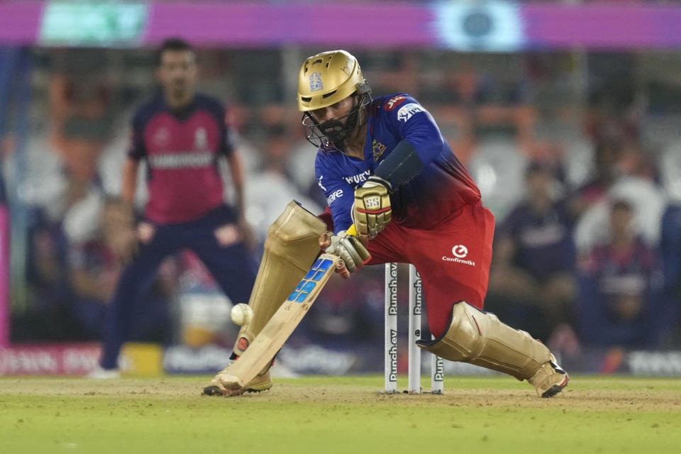 Royal Challengers Bengaluru's Dinesh Karthik plays a shot during the Indian Premier League eliminator cricket match between Royal Challengers Bengaluru and Rajasthan Royals in Ahmedabad, India, Wednesday, May 22, 2024. (AP Photo/Ajit Solanki)