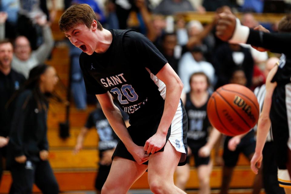 Saint Joseph junior Chase Konieczny reacts after making a shot while being fouled in the third overtime of an IHSAA Class 3A boys basketball semistate championship game against Delta Saturday, March 16, 2024, at Logansport High School.